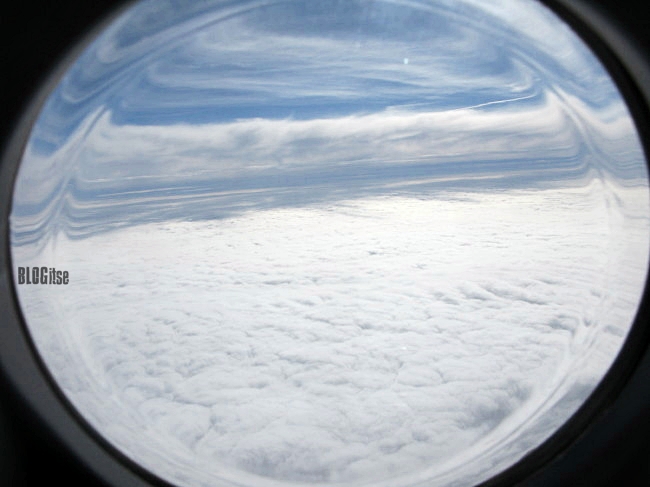 sky from a plane window by BLOGitse