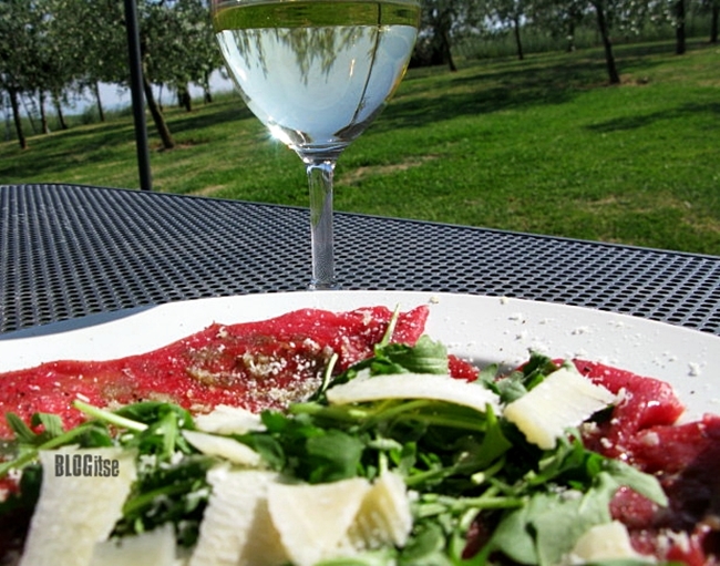 beef carpaccio and white wine under the Tuscan sun by BLOGitse