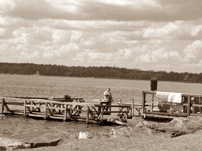 washing carpets at the beach in Helsinki Finland by BLOGitse